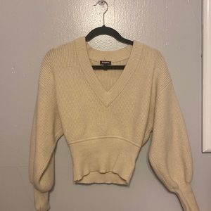 A cream-colored sweater by Express in a size small:))